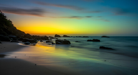 Coastal Serenity Golden Hour Light Reflecting on the Beach and Sea