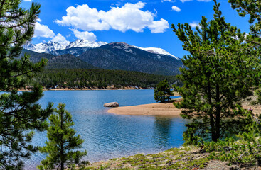 Pikes Peak panorama, Snow-capped and forested mountains near a mountain lake, Pikes Peak Mountains in Colorado Spring