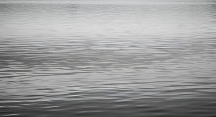 Obraz premium Gentle Silver Reflections on Water Surfaces Capturing Subtle Ripple Patterns