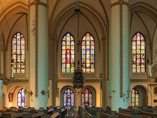 Luneburg, Germany. Stained glass windows in the nave of St. Johannis (Church of John the Baptist). The church was built between 1300 and 1370 and repaired in 1420.