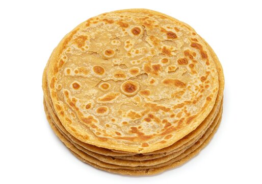 Stack of homemade paratha flatbreads, a popular indian bread isolated on white background