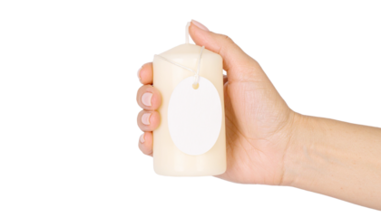 a hand holding a candle with a blank tag, offering a sense of warmth and potential. A simple, elegant presentation, ready for personalization