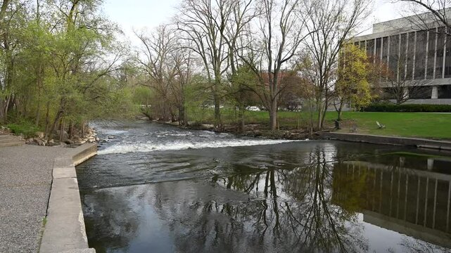 Flowing smooth water on the Red Cedar River at Michigan State University