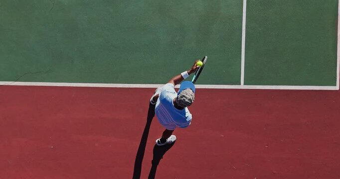 Above, tennis court and senior man with racket for game, fitness and activity for retirement. Top view, player and mature person with ball for competition, match and sports with training and athlete - Powered by Adobe