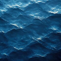 Stunning blue ocean waves rolling gracefully towards the shore under a clear bright sky on a sunny day