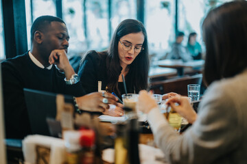 A diverse group of professionals engage in a brainstorming session at a cozy cafe. This moment highlights teamwork, collaboration, and creativity in an inspiring setting.