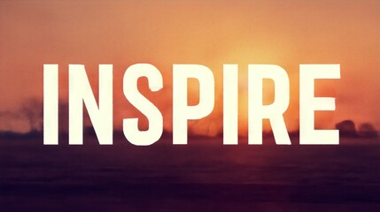 Bold "INSPIRE" text illuminated against a warm sunset backdrop, symbolizing motivation, positivity, and the pursuit of dreams