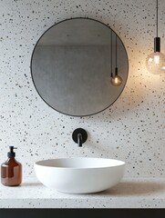 The image showcases a stylish modern bathroom. The wall features dual color tiles in white and tan that create an elegant backdrop for the room. A round mirror with a black frame is mounted above the