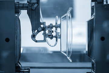 The plastic kitchen wear parts production process by injection machine in the light blue scene.