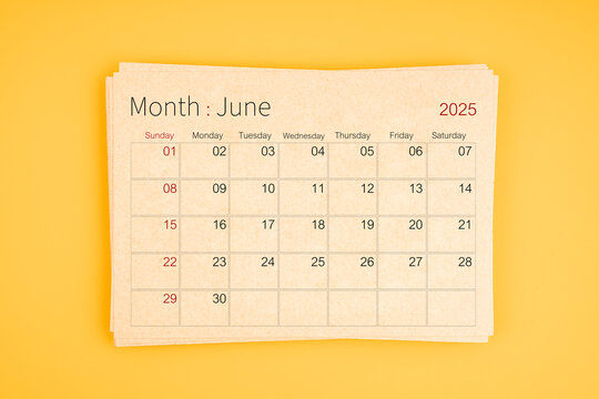 June 2025 calendar from brown recycle paper on yellow background. - Powered by Adobe