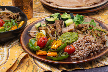 Buckwheat, seitan roast, pesto and veggie platter, an Eastern European dish