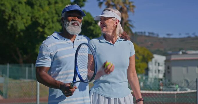 Senior, talking and tennis with interracial couple walking on court for retirement or sports together. Exercise, fitness or hobby with mature man and woman talking for activity, bonding or training