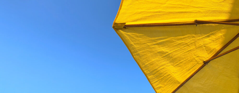 A beach umbrella is an indispensable accessory for a comfortable stay on the beach, protecting from direct sunlight and creating a cozy shade on the beach by the sea in hot weather.