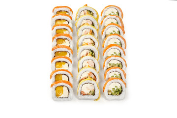 Sushi rolls with mango, cucumber and shrimp filling on white background