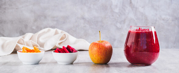 ABC juice from beetroot, carrot and apple for detox in a glass on the table web banner