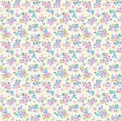 Beautiful cute floral pattern in small bright flowers. Small lilac, pink and blue flowers. Ivory cream background. Ditsy print. Floral seamless background. Gentle template for fashion prints. Stock