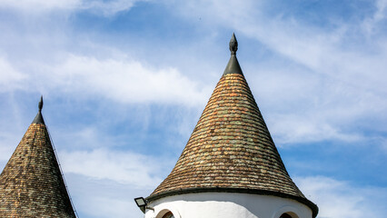 Unique conical rooftops against cloudy sky, medieval architecture, cultural heritage, inspiration...