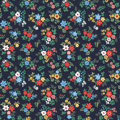 Vector seamless pattern. Bright pattern in small flowers. Small colorful flowers. Dark blue background. Ditsy floral background. Vintage template for fashion prints. Stock vector. Fashion print