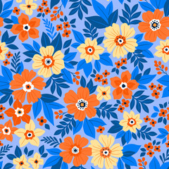 Beautiful floral pattern in small flowers. Small orange and light yellow flowers. Blue background. Ditsy print. Floral seamless background. Bright template for fashion prints. Easter Stock pattern.