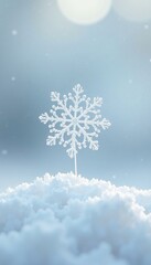 A delicate snowflake rests on a mound of soft snow under a gentle winter light.