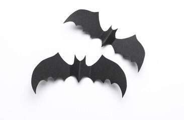 Paper cut black bats on white background. Halloween decor