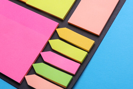 Various blank paper multicolored stickers. Sticky note collection on blue background