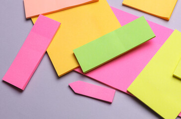 Various blank paper multicolored stickers. Sticky note collection on gray background