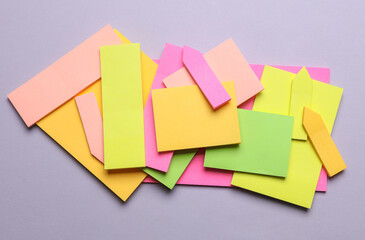 Various blank paper multicolored stickers. Sticky note collection on gray background