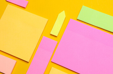 Various blank paper multicolored stickers. Sticky note collection on yellow background