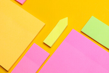 Various blank paper multicolored stickers. Sticky note collection on yellow background