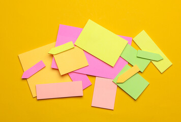 Various blank paper multicolored stickers. Sticky note collection on yellow background