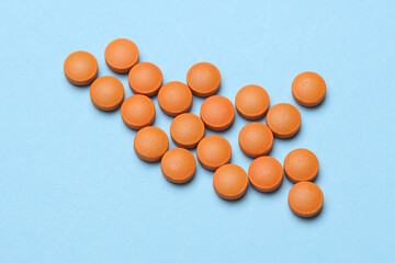 Orange pills on a blue background