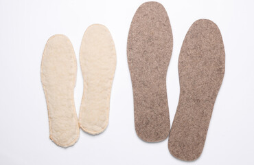 Warm insoles on a white background