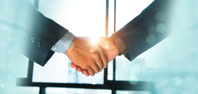 Trusted partner. Businessmen making handshake with partner, greeting, dealing, merger and acquisition, business cooperation concept, joint venture, Build trust in business and finance relationships.
