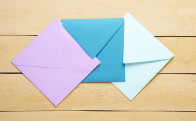 Set of colored envelopes on yellow wooden boards. Creative layout