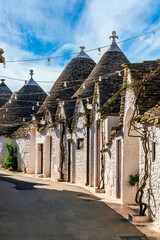 beautiful pretty vintahe houses with blue cloudy sky on background. old mediterranean home for...