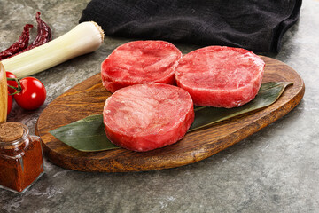 Delicous raw tuna medallion for cooking