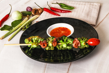 Thai Street foof satay with bacon and broccoli