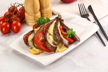 Baked tomato with mozzarella and tomato