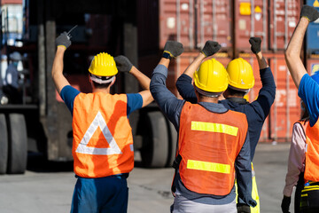 Strike of workers in container yard. Group of multiethnic engineer people during a protest in...