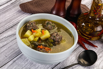 Soup with beef meatballs and vegetables