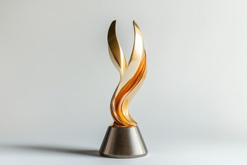 Elegant golden award trophy with a swirling, abstract design on a metallic base.
