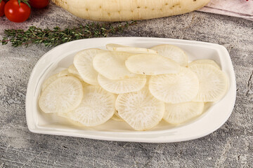 Sliced white daikon radish in the bowl