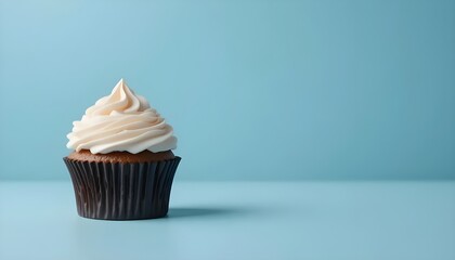 Single minimalist cupcake placed against a soft blue background, perfect for promotional bakery images or clean, modern dessert-themed visuals.
