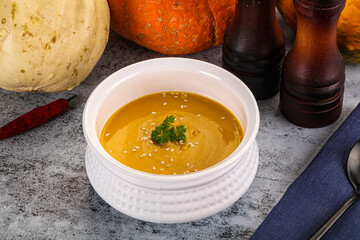 Vegan pumpkin cream soup served sesam