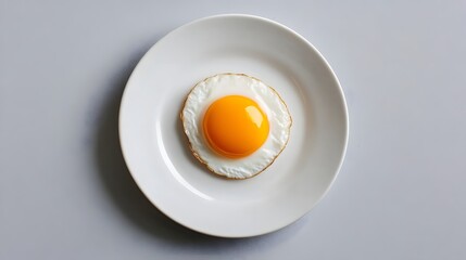 Minimalist Elegance:A Raw Egg Delicately Perched on a White Plate