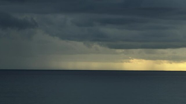 From above, the storm clouds over the ocean grow darker and more menacing, reflecting the rising frequency of extreme weather patterns driven by climate change.
