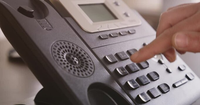 Headset and dialing a telephone in call center office concept , call center and customer service help desk