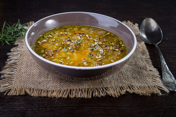 Vegetarian pea soup with sesame and sunflower seeds