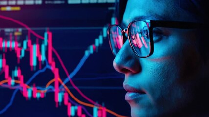 Close-up computer screen candlestick charts moving averages, reflected vividly pair rimless glasses neon blue magenta ambient glow, shallow depth field, cinematic lens flare, 4K - Powered by Adobe